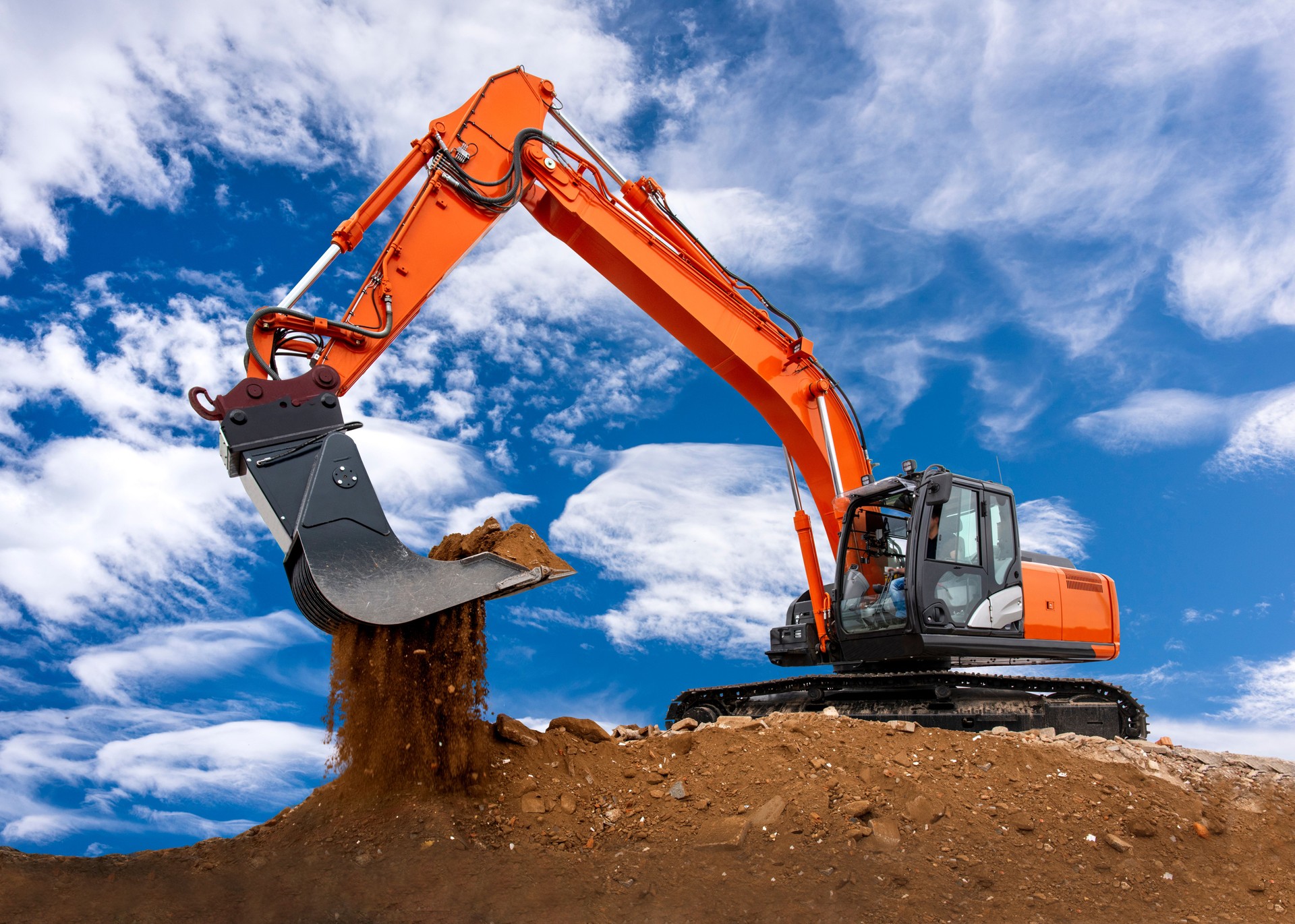 excavator is digging and loading at construction site
