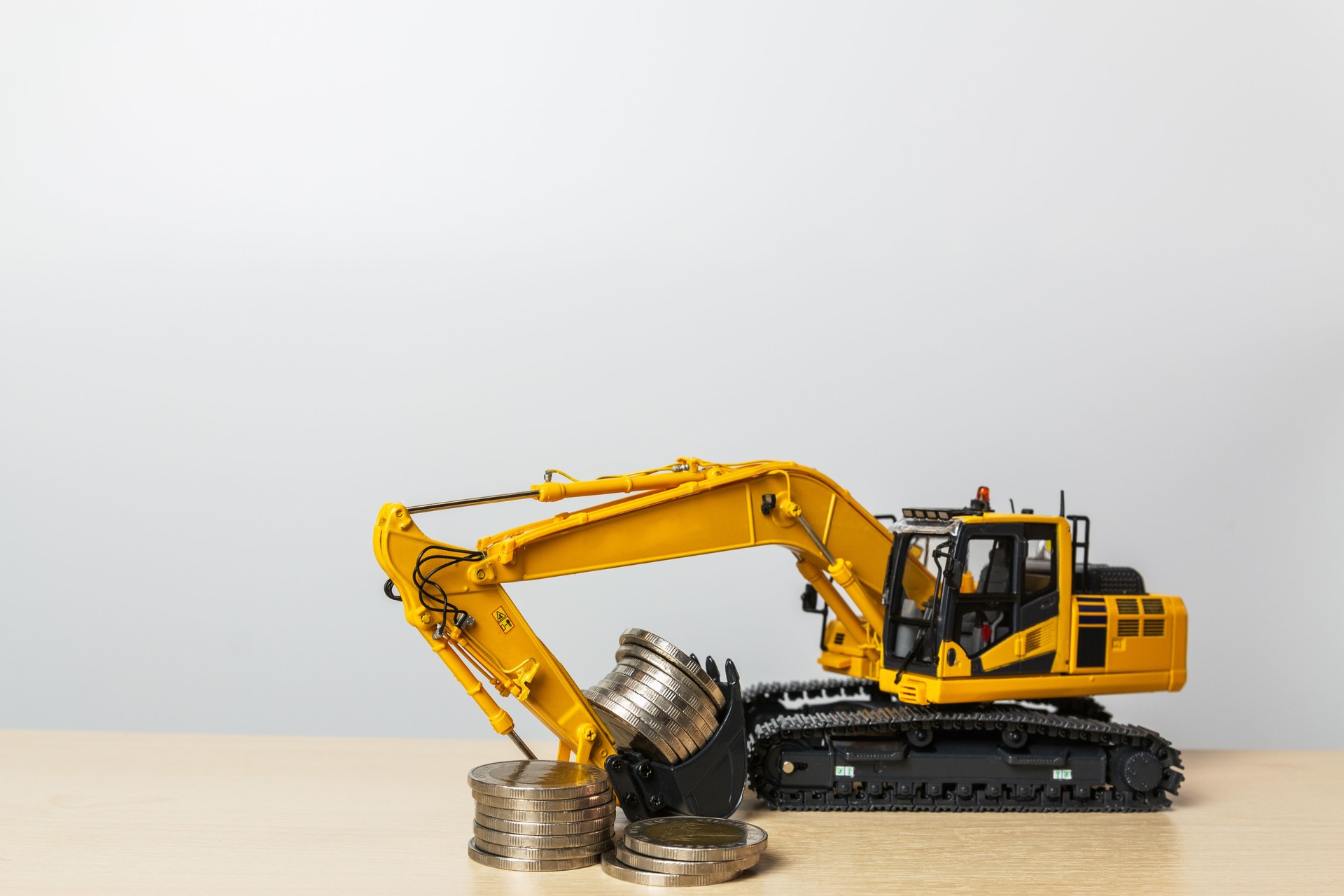 Excavator  model  with a money save concept, in  bucket