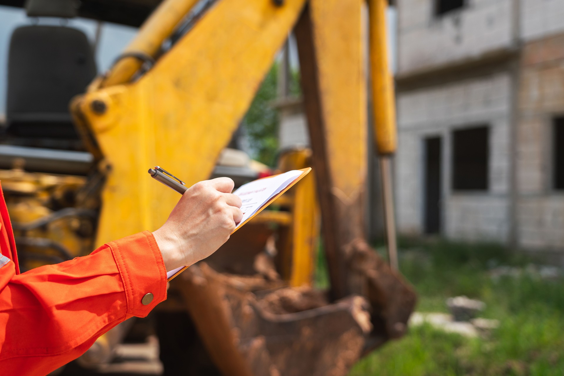 Inspection the excavator machine, construction working.
